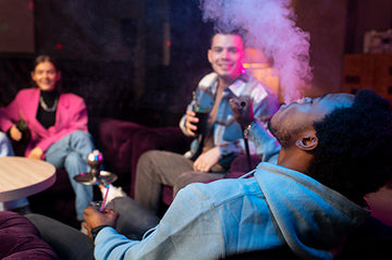 A group of people smoking cannabis together